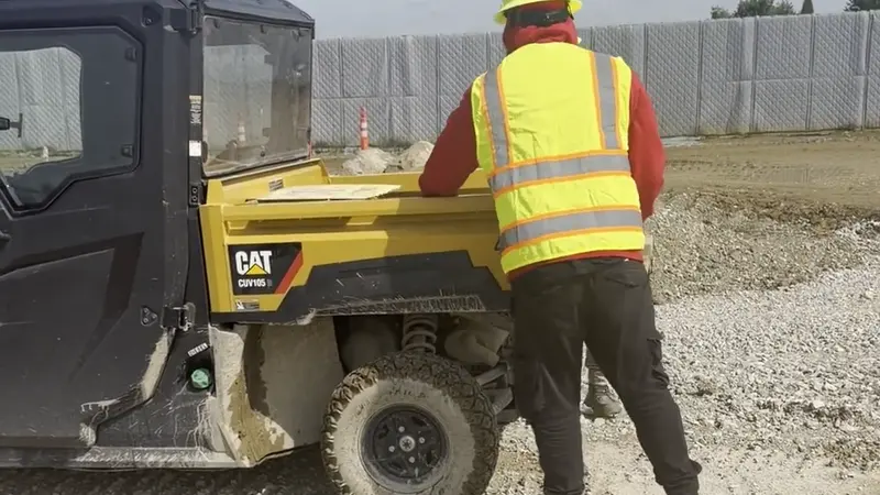 A Star City Environmental crew moving material on an active construction site.